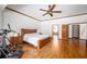This spacious bedroom features an exercise bike, ceiling fan and wood accents at 725 Bear Creek Cir, Winter Springs, FL 32708