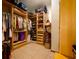Large walk-in closet with custom shelving, hanging racks and tile floor at 725 Bear Creek Cir, Winter Springs, FL 32708