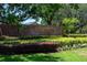 Bear Creek Estates entrance with lush landscaping and brick signage at 725 Bear Creek Cir, Winter Springs, FL 32708