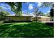 Brick home with lush green lawn and mature trees at 725 Bear Creek Cir, Winter Springs, FL 32708