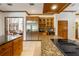 A gourmet kitchen featuring granite countertops, stainless steel appliances, and a wine refrigerator at 725 Bear Creek Cir, Winter Springs, FL 32708