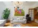 Bright living room with hardwood floors, stylish furnishings, and a view of the open doorway at 725 Bear Creek Cir, Winter Springs, FL 32708