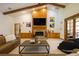 Living room featuring a fireplace and exposed ceiling beams at 725 Bear Creek Cir, Winter Springs, FL 32708