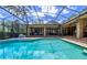 Spacious screened-in pool with covered patio and plenty of room for entertaining at 725 Bear Creek Cir, Winter Springs, FL 32708