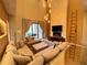 Inviting living room with comfortable seating, a stone accent wall, and sliding glass doors to the patio at 7458 Brooklyn Dr, Kissimmee, FL 34747