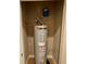 A close-up view of a water heater inside a closet at 7458 Brooklyn Dr, Kissimmee, FL 34747