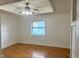 Dining room showcasing a tray ceiling, and classic wainscoting at 7540 Govern Blvd, Orlando, FL 32822