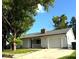 Charming single-story home featuring a well-maintained lawn, attached garage, and inviting curb appeal at 7540 Govern Blvd, Orlando, FL 32822
