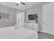 Relaxing bedroom with a double bed, TV, and ample closet space for comfort at 7584 Marker Ave, Kissimmee, FL 34747