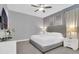 Modern bedroom featuring a large bed, TV, and ample closet space for storage at 7584 Marker Ave, Kissimmee, FL 34747