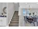 Staircase adjacent to dining area with an elegant table set for a dinner party at 7584 Marker Ave, Kissimmee, FL 34747