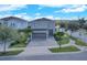 Two story home featuring a neutral color scheme, paved drive and manicured landscaping at 7584 Marker Ave, Kissimmee, FL 34747