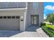 Close-up of the home's entry, with its paved drive and two car garage at 7584 Marker Ave, Kissimmee, FL 34747