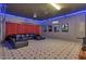 Finished basement featuring a home theater with a projector, movie posters, and a comfortable sectional sofa at 7584 Marker Ave, Kissimmee, FL 34747