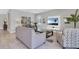 Cozy living room with comfortable seating, a modern entertainment center, and neutral decor at 7584 Marker Ave, Kissimmee, FL 34747