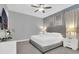 Comfortable main bedroom featuring carpet floors, TV, ceiling fan and neutral decor at 7584 Marker Ave, Kissimmee, FL 34747
