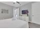 Comfortable main bedroom featuring carpet floors, dresser and neutral decor at 7584 Marker Ave, Kissimmee, FL 34747