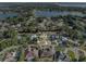 Breathtaking aerial view showcases a stunning home surrounded by lush greenery and serene lakes at 7957 S Park Pl, Orlando, FL 32819