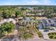 An impressive property with verdant roof, private pool, lush landscaping and circular driveway at 7957 S Park Pl, Orlando, FL 32819
