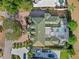 Aerial view of a house with an attractive green roof and screened pool area at 7957 S Park Pl, Orlando, FL 32819