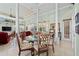 Dining area features open layout, decorative columns, and views of the living room at 7957 S Park Pl, Orlando, FL 32819