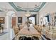 Elegant dining room with chandelier, marble floors, stained glass and sophisticated decor for upscale entertaining at 7957 S Park Pl, Orlando, FL 32819