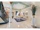 Elegant dining room featuring marble floors, a chandelier, and sophisticated decor, ideal for upscale entertaining at 7957 S Park Pl, Orlando, FL 32819