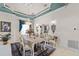 Formal dining room featuring a chandelier, marble floors, and sophisticated decor for elegant dining at 7957 S Park Pl, Orlando, FL 32819