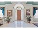 Grand foyer with marble floors, stained glass window, and ornate decorations create a luxurious entrance at 7957 S Park Pl, Orlando, FL 32819