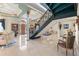 Grand foyer showcases spiral staircase, columns, marble floors, and sophisticated decorations at 7957 S Park Pl, Orlando, FL 32819