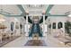 Grand foyer with a marble floor, statue, winding staircase, and elegant decor at 7957 S Park Pl, Orlando, FL 32819