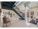 Expansive foyer featuring a spiral staircase, marble floors, and elegant decor elements at 7957 S Park Pl, Orlando, FL 32819
