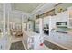 Bright kitchen with granite countertops, large island, and stainless steel appliances at 7957 S Park Pl, Orlando, FL 32819