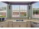 Kitchen area with granite countertops and large windows for natural light at 7957 S Park Pl, Orlando, FL 32819