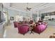 Bright living room featuring tray ceilings, marble floors, and lots of natural light at 7957 S Park Pl, Orlando, FL 32819