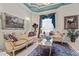 Elegant living room featuring marble floors, luxury furniture, a chandelier, and natural light at 7957 S Park Pl, Orlando, FL 32819