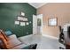 Home office featuring a sofa, and doorway into another room at 7957 S Park Pl, Orlando, FL 32819