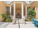 Covered patio dining space with Roman mural and potted plants at 7957 S Park Pl, Orlando, FL 32819
