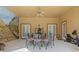 View of outdoor dining space with Roman mural, fan and workout machine at 7957 S Park Pl, Orlando, FL 32819