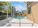 The screened-in pool with a jacuzzi and summer kitchen enhance the property's appeal at 7957 S Park Pl, Orlando, FL 32819