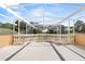 Large rooftop terrace with balustrade railing and pergola, offering panoramic views at 7957 S Park Pl, Orlando, FL 32819