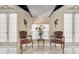 Cozy sitting area featuring marble floors, decorative wall sconces, and natural light, creating a welcoming ambiance at 7957 S Park Pl, Orlando, FL 32819
