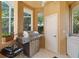 A well-equipped summer kitchen with a grill and counter space for outdoor cooking at 7957 S Park Pl, Orlando, FL 32819