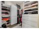 Walk-in closet featuring ample storage with adjustable shelving and drawers at 7957 S Park Pl, Orlando, FL 32819