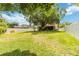 Expansive backyard featuring lush green grass and a privacy fence at 905 N Lake Claire Cir, Oviedo, FL 32765