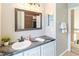 Updated bathroom featuring modern vanity, new mirror, and bathtub/shower combo at 905 N Lake Claire Cir, Oviedo, FL 32765