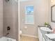 Clean and modern bathroom featuring bathtub, shower, and modern vanity at 905 N Lake Claire Cir, Oviedo, FL 32765