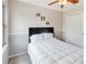 Cozy bedroom with a ceiling fan, closet, and natural light at 905 N Lake Claire Cir, Oviedo, FL 32765