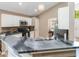 A well-lit kitchen features custom countertops, wood accents, and modern lighting at 905 N Lake Claire Cir, Oviedo, FL 32765
