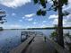 Scenic lake view from a wooden pier, showcasing the tranquil waterfront setting at 905 N Lake Claire Cir, Oviedo, FL 32765